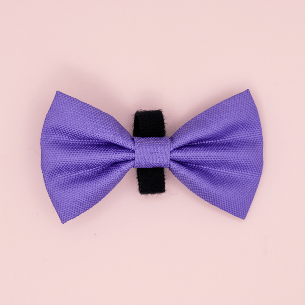 Purple dog bow tie with velcro band on a light pink background - Pupclub Couture
